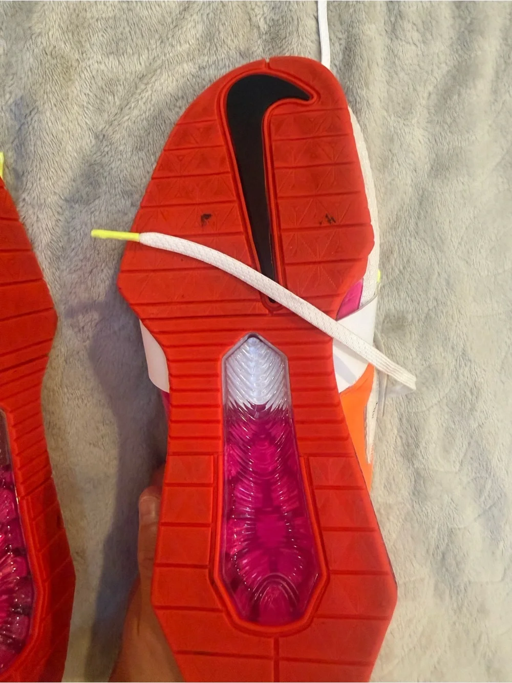 Nike White Athletic Shoes with Black Swoosh and Red Sole